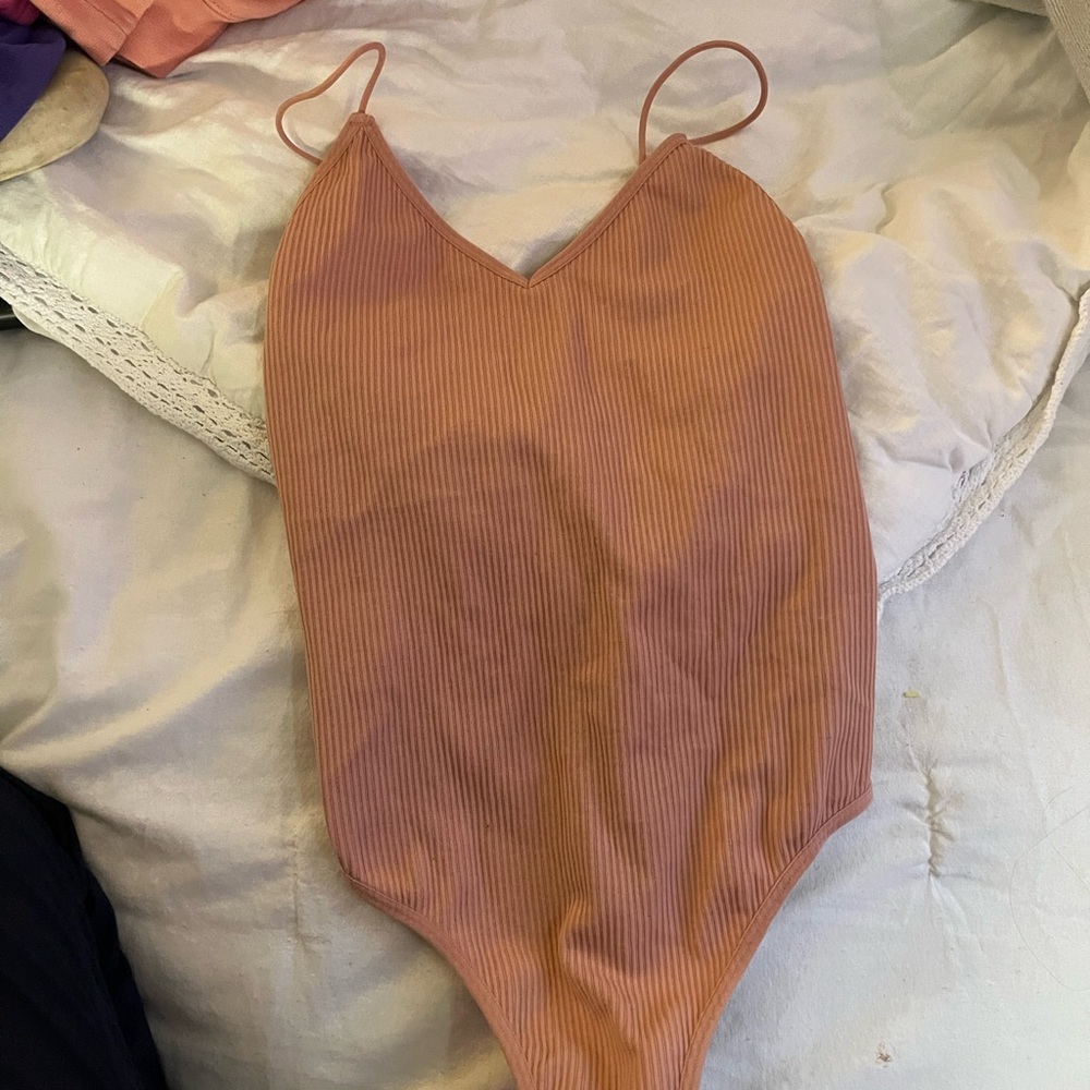 Pink body suit